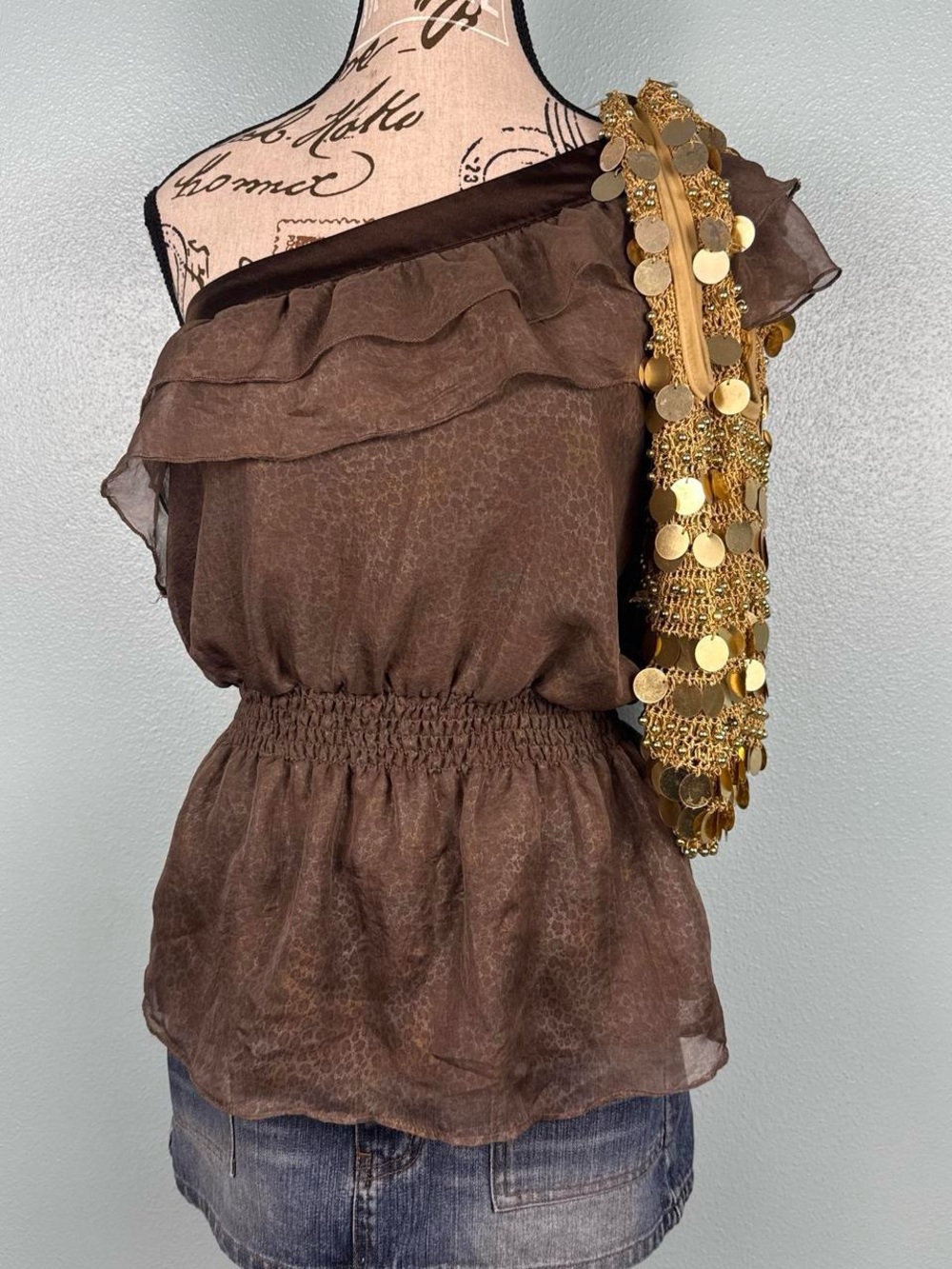 bebe Brown One-Shoulder Ruffle Peplum Top with Gold Accent
